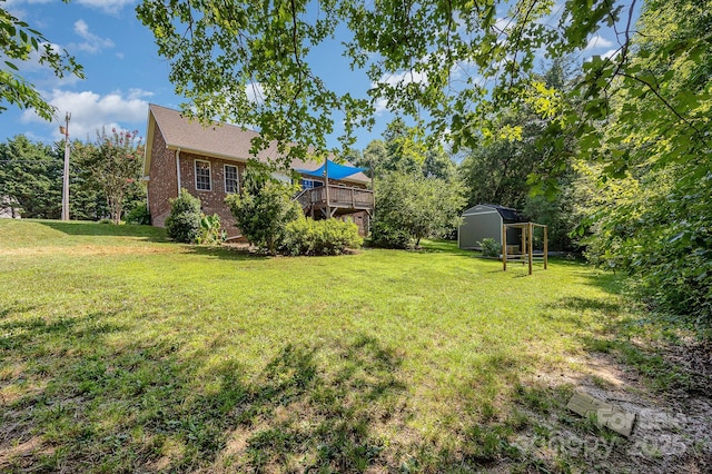 610 Mountain Pl, Albemarle, NC 28001 - view of green lawn with a storage unit and a deck