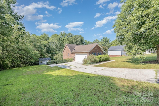 610 Mountain Pl, Albemarle, NC 28001 - view of front facade featuring brick siding, a front yard, a storage unit, driveway, and a garage