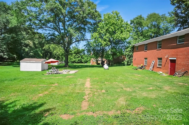 113 N Academy St, Mooresboro, NC 28114 - view of green lawn featuring a shed