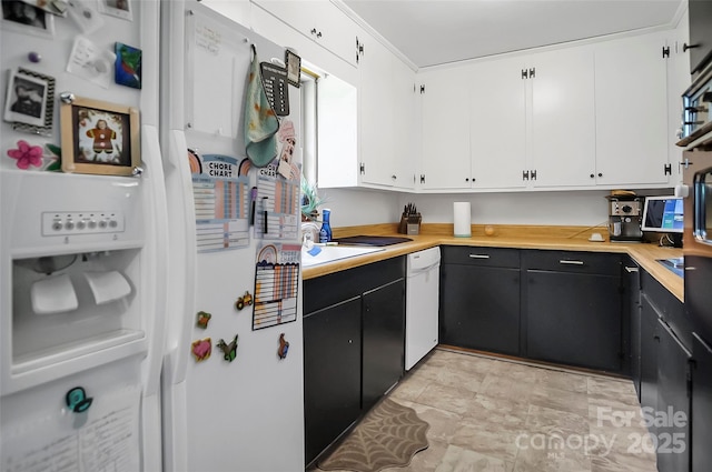 113 N Academy St, Mooresboro, NC 28114 - kitchen featuring white appliances, white cabinetry, light countertops, and dark cabinets