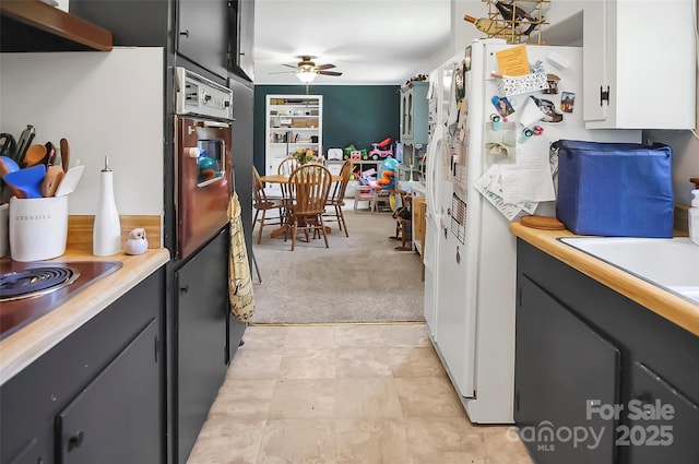 113 N Academy St, Mooresboro, NC 28114 - kitchen with oven, a ceiling fan, exhaust hood, light countertops, and light carpet