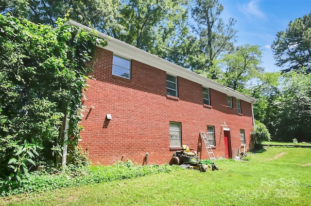 113 N Academy St, Mooresboro, NC 28114 - view of side of property featuring a lawn and brick siding