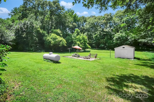 113 N Academy St, Mooresboro, NC 28114 - view of green lawn featuring a storage unit and a fire pit