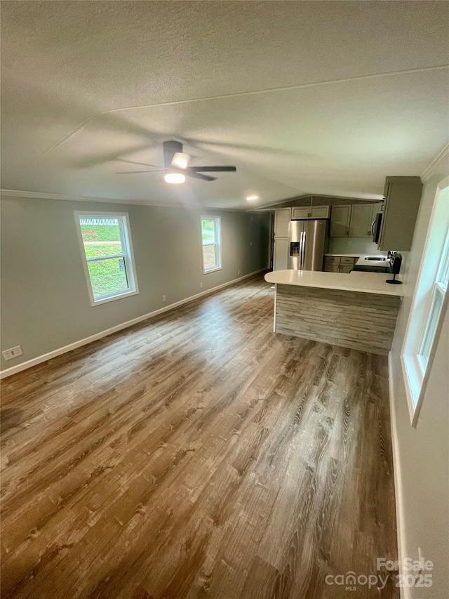 6517 Helens Way, Denver, NC 28037 - unfurnished living room with a ceiling fan and wood finished floors