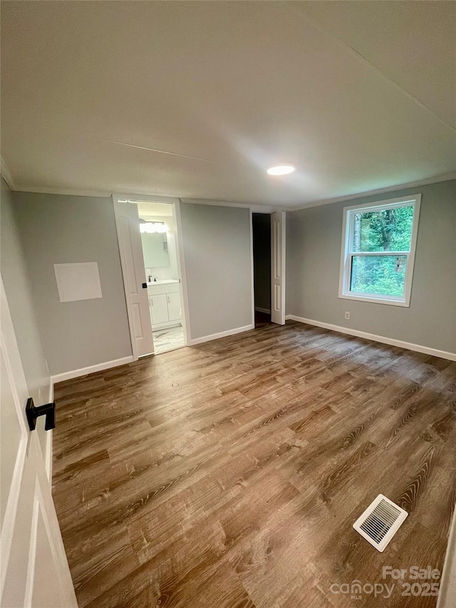 6517 Helens Way, Denver, NC 28037 - spare room with wood finished floors and crown molding