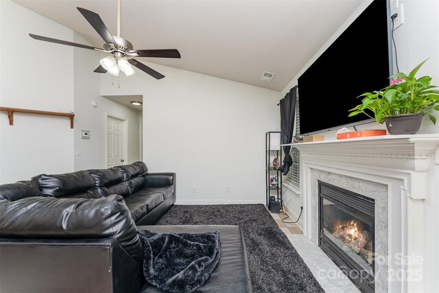 5914 Redding Rd, Charlotte, NC 28216 - living area featuring lofted ceiling, a premium fireplace, and ceiling fan