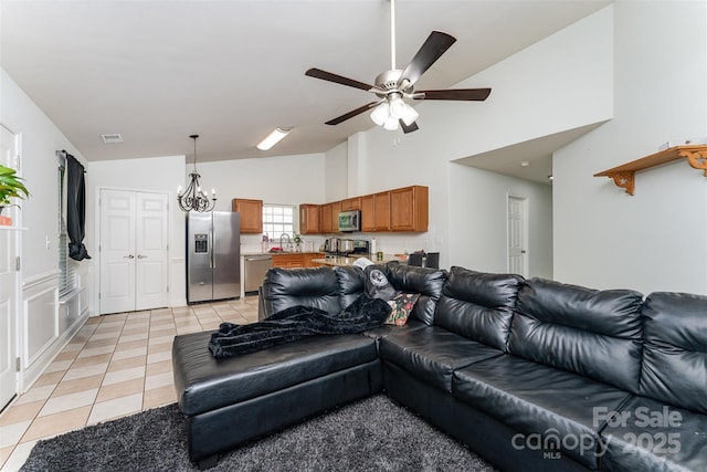 5914 Redding Rd, Charlotte, NC 28216 - living room featuring light tile patterned floors, a ceiling fan, and high vaulted ceiling