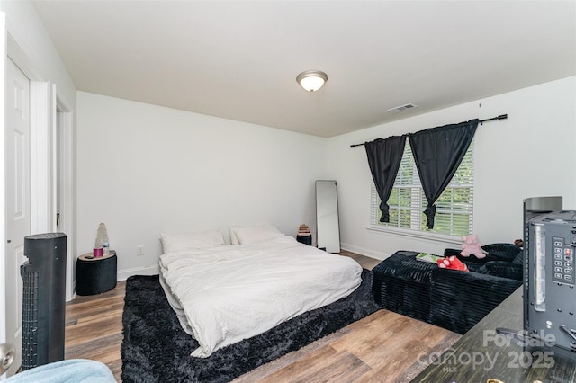 5914 Redding Rd, Charlotte, NC 28216 - bedroom featuring wood finished floors and baseboards