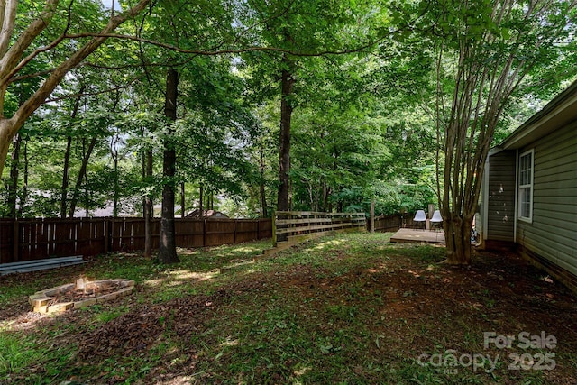 5914 Redding Rd, Charlotte, NC 28216 - fenced backyard with a fire pit