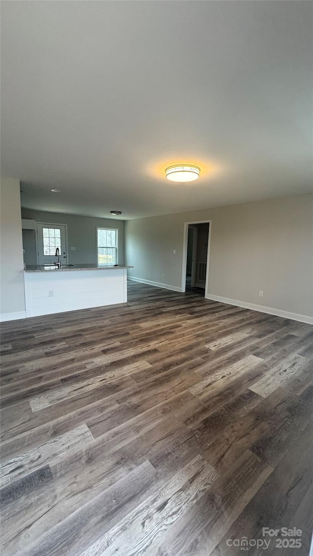 440 Brown Acres Rd, Salisbury, NC 28146 - unfurnished living room featuring dark wood finished floors and baseboards