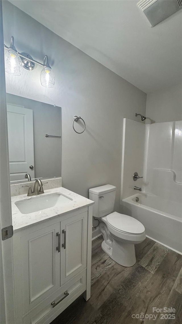 440 Brown Acres Rd, Salisbury, NC 28146 - full bath with wood finished floors, vanity, and washtub / shower combination