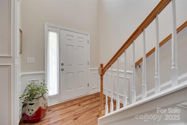 1930 Caprington Dr, Fort Mill, SC 29707 - foyer entrance with light wood-style floors and stairway