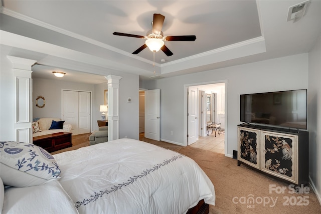 1930 Caprington Dr, Fort Mill, SC 29707 - bedroom with ornate columns, a tray ceiling, light carpet, crown molding, and ceiling fan
