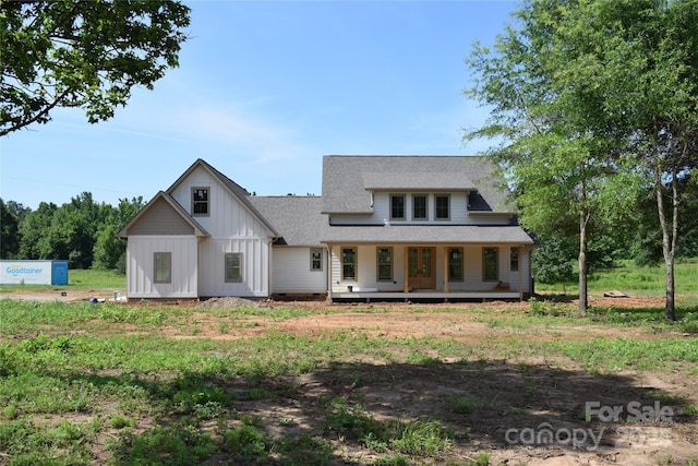 960 Johnson Rd, Columbus, NC 28722 - view of front of house featuring board and batten siding, roof with shingles, and a porch