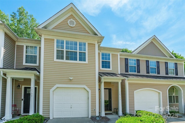 14755 Lions Paw St, Charlotte, NC 28273 - view of front of house with a garage, a standing seam roof, concrete driveway, and a metal roof