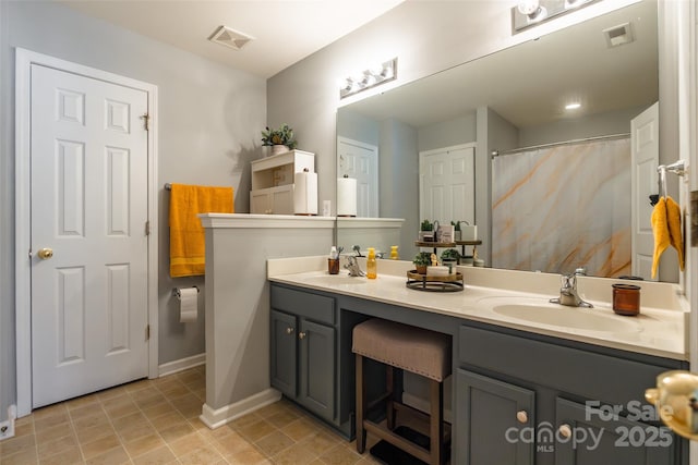 14755 Lions Paw St, Charlotte, NC 28273 - bathroom with double vanity and baseboards