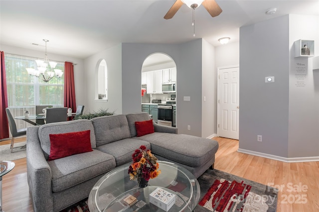 14755 Lions Paw St, Charlotte, NC 28273 - living room with a chandelier, light wood-type flooring, and ceiling fan
