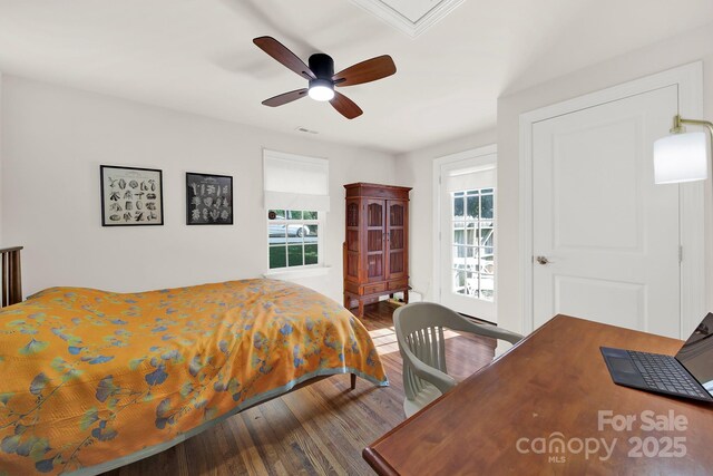 2314 Wolfe St, Charlotte, NC 28205 - bedroom featuring wood finished floors, multiple windows, and ceiling fan