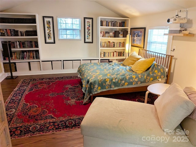 2314 Wolfe St, Charlotte, NC 28205 - bedroom with vaulted ceiling and wood finished floors