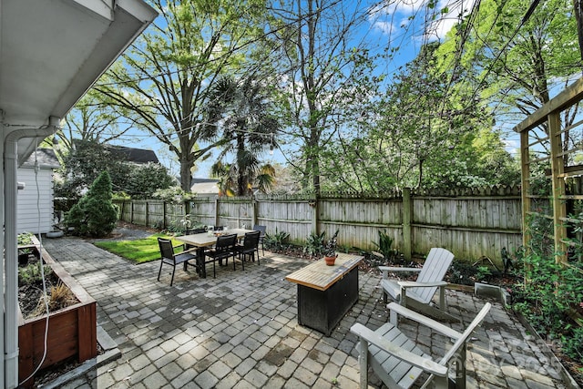 2314 Wolfe St, Charlotte, NC 28205 - fenced backyard with outdoor dining space and a patio area