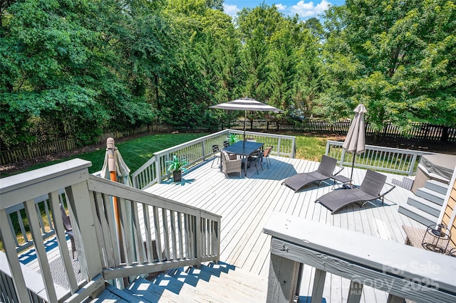 10104 Treetop Ln, Cornelius, NC 28031 - wooden terrace with outdoor dining space and a fenced backyard