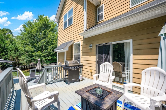 10104 Treetop Ln, Cornelius, NC 28031 - wooden terrace featuring an outdoor fire pit and a grill