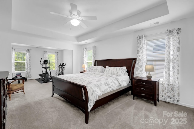 10104 Treetop Ln, Cornelius, NC 28031 - bedroom featuring a tray ceiling, carpet, and ceiling fan