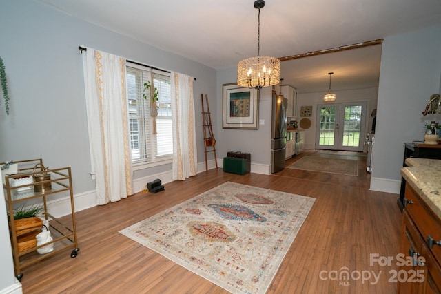 1712 Umstead St, Charlotte, NC 28205 - dining area featuring a chandelier and wood finished floors