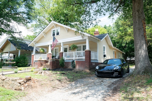 1712 Umstead St, Charlotte, NC 28205 - view of front of house with covered porch and a chimney