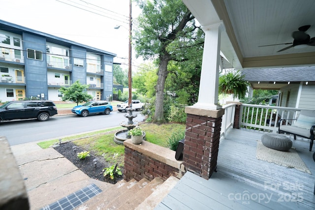 1712 Umstead St, Charlotte, NC 28205 - wooden porch with ceiling fan