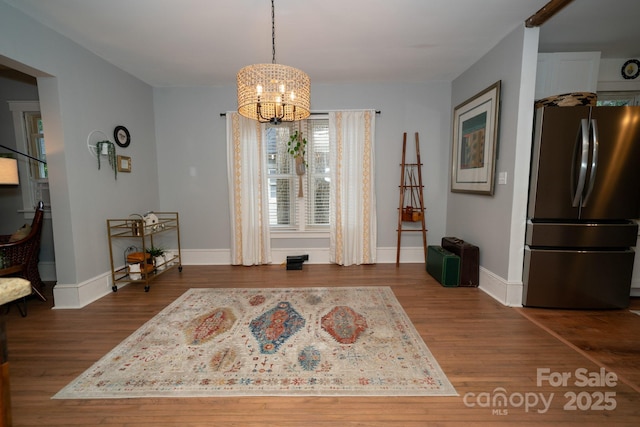 1712 Umstead St, Charlotte, NC 28205 - dining space featuring dark wood finished floors and a chandelier