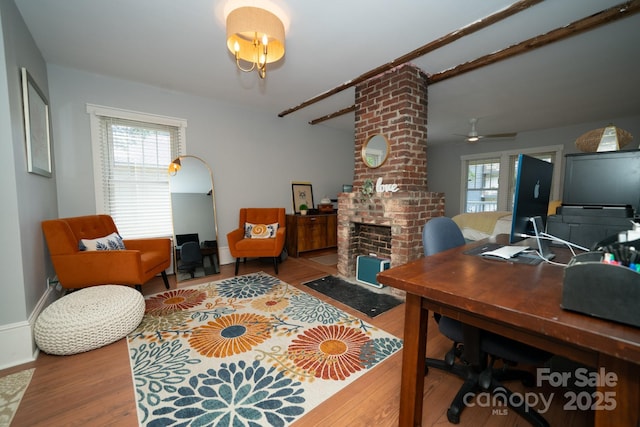 1712 Umstead St, Charlotte, NC 28205 - office area featuring wood finished floors, a fireplace, and a ceiling fan