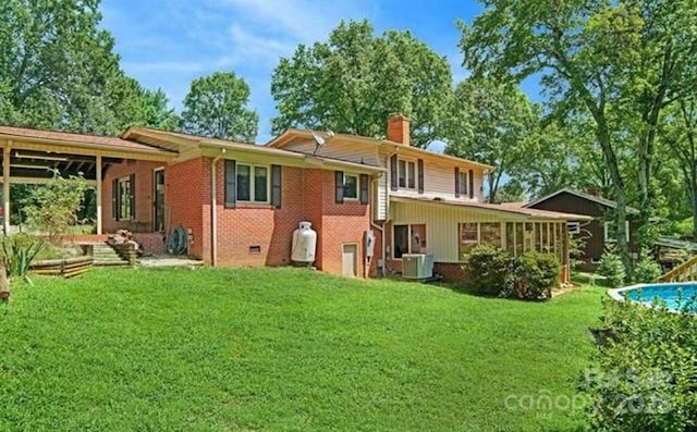 408 E Blume St, Landis, NC 28088 - rear view of property with brick siding, a chimney, and a lawn
