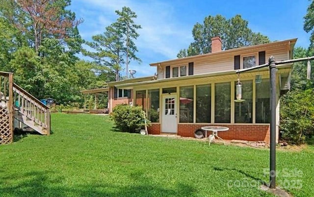 408 E Blume St, Landis, NC 28088 - back of house featuring a sunroom, a chimney, a yard, and stairs
