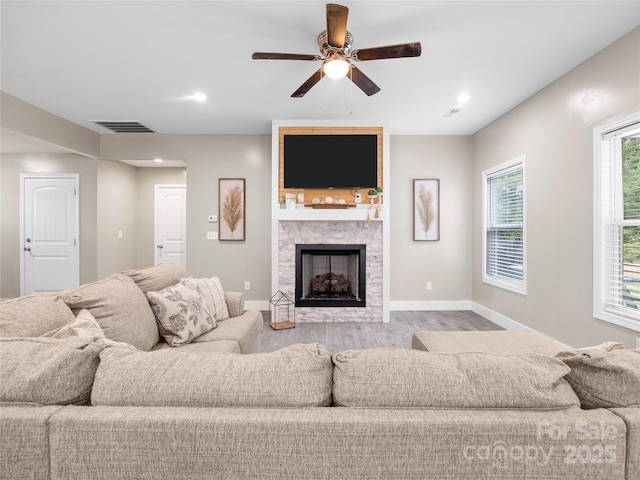 226 Oak Brook Ln Unit 21, Gaffney, SC 29341 - living room with wood finished floors, a stone fireplace, ceiling fan, and recessed lighting