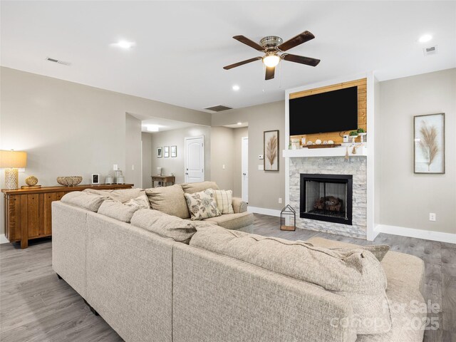 226 Oak Brook Ln Unit 21, Gaffney, SC 29341 - living room featuring a ceiling fan, light wood-style floors, a stone fireplace, and recessed lighting