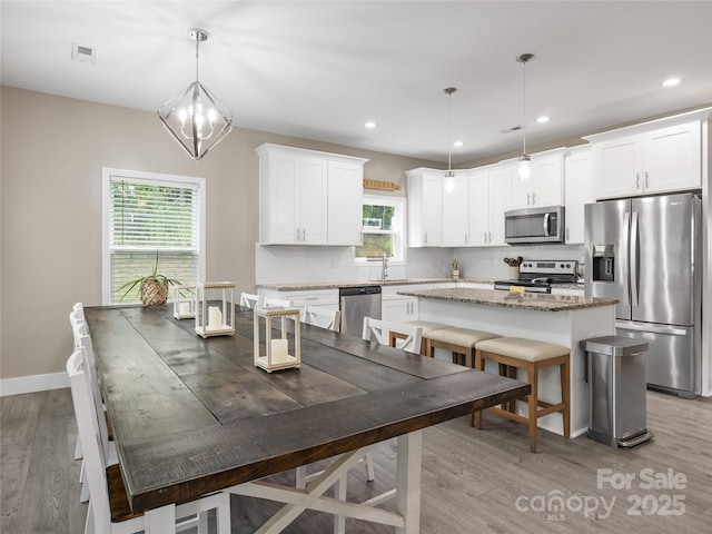 226 Oak Brook Ln Unit 21, Gaffney, SC 29341 - dining area featuring healthy amount of natural light, light wood-style flooring, and recessed lighting