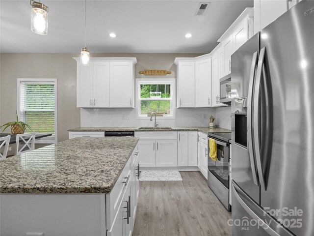 226 Oak Brook Ln Unit 21, Gaffney, SC 29341 - kitchen featuring stainless steel appliances, light wood-style floors, white cabinets, decorative backsplash, and recessed lighting