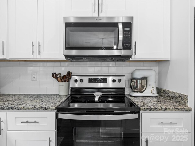 226 Oak Brook Ln Unit 21, Gaffney, SC 29341 - kitchen featuring stainless steel appliances, white cabinets, tasteful backsplash, and light stone counters