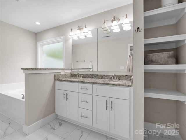 226 Oak Brook Ln Unit 21, Gaffney, SC 29341 - full bath with marble look tile flooring, double vanity, a garden tub, and recessed lighting