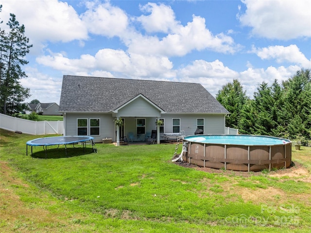 226 Oak Brook Ln Unit 21, Gaffney, SC 29341 - rear view of property with a trampoline, an outdoor pool, and roof with shingles