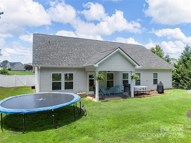 226 Oak Brook Ln Unit 21, Gaffney, SC 29341 - rear view of property featuring a trampoline, a patio area, and a shingled roof