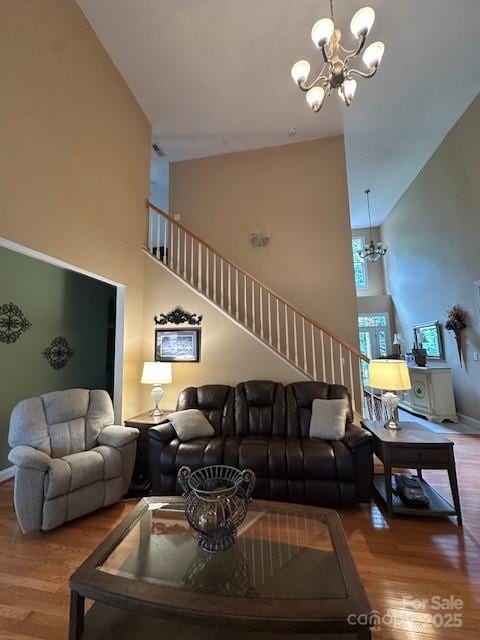 104 Whimbrel Ln, Mooresville, NC 28117 - living room with a chandelier, stairs, high vaulted ceiling, and wood finished floors