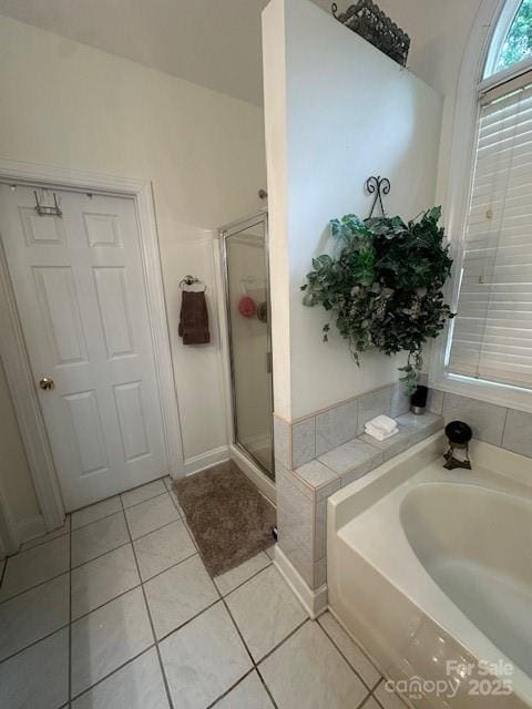 104 Whimbrel Ln, Mooresville, NC 28117 - full bathroom featuring tile patterned flooring, a bath, and a stall shower