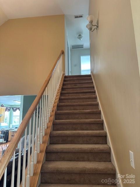 104 Whimbrel Ln, Mooresville, NC 28117 - staircase with healthy amount of natural light and high vaulted ceiling