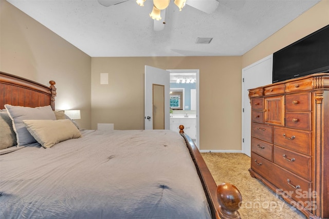 116 Eastwood Park Dr SE, Lenoir, NC 28645 - bedroom with light carpet, a textured ceiling, ensuite bath, and ceiling fan