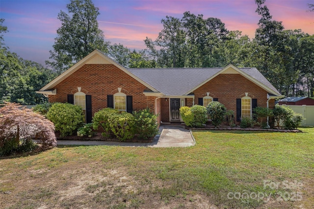 2916 Northwood Dr, Monroe, NC 28110 - view of front of property featuring brick siding, a yard, and a shingled roof