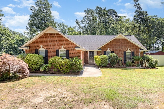 2916 Northwood Dr, Monroe, NC 28110 - view of front of property featuring brick siding, a front yard, and roof with shingles