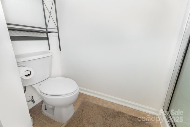 2916 Northwood Dr, Monroe, NC 28110 - bathroom with baseboards and a shower with door