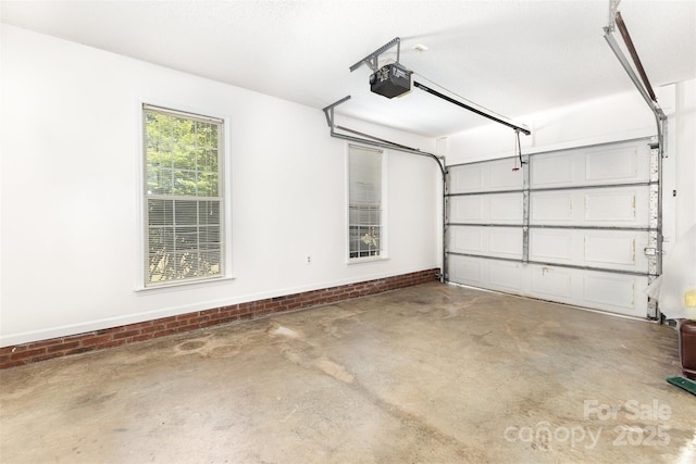 2916 Northwood Dr, Monroe, NC 28110 - garage featuring a garage door opener and baseboards